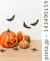 Halloween pumpkin jack o lantern with lit candles and spiders 143490159