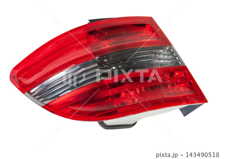 A taillight of a stop signal for a German auto - optical equipment of white and red color on a white isolated background. A spare part for repair and sale in a car service center 143490518