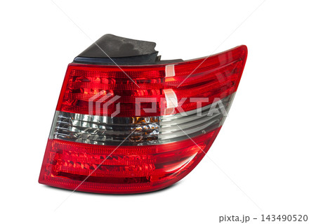 A taillight of a stop signal for a German auto - optical equipment of white and red color on a white isolated background. A spare part for repair and sale in a car service center 143490520