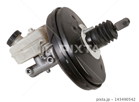 Black metal vacuum brake booster for repair and replacement on a car in a workshop on a white isolated background. Spare parts catalog for cars 143490542