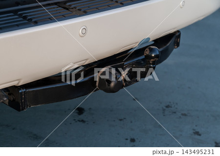 Close up, black car tow hitch, view of the vehicle hitch closeup. Close up, black car tow hitch, view of the vehicle hitch closeup. 143495231