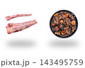 Raw oxtail sections beside a bowl of braised beef stew with carrots floating above soft shadows on white 143495759