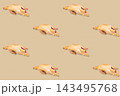 Whole raw duck carcasses repeated in evenly spaced rows across a beige background for a culinary poultry pattern 143495768