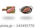 Raw chuck eye steak on a wooden board beside cooked beef in a black pan floating above soft shadows on white 143495770
