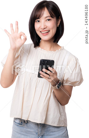 Happy smiling asian woman holding smartphone making ok hand sign showcasing modern artificial intelligence digital mobile communication technology isolated on transparency background Happy smiling asian woman holding smartphone making ok hand sign showcasing modern artificial intelligence digital mobile communication technology isolated on transparency background 143496180
