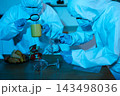 Forensic expert collecting a blood sample at a crime scene for laboratory analysis, DNA testing, criminal investigation, evidence examination, and justice. 143498036