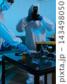 Forensic expert collecting a blood sample at a crime scene for laboratory analysis, DNA testing, criminal investigation, evidence examination, and justice. 143498050