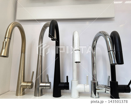 Modern bathroom fixtures displayed inside home improvement store Modern bathroom fixtures displayed inside home improvement store 143501378