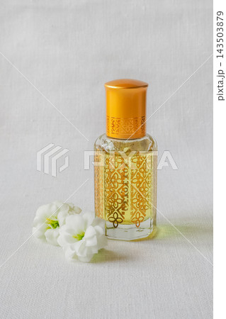 Traditional Arabian Attar Perfume Oil Bottle with Jasmine Blossom Aesthetic Traditional Arabian Attar Perfume Oil Bottle with Jasmine Blossom Aesthetic 143503879