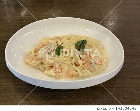 Creamy Seafood Spaghetti Served on White Plate Creamy Seafood Spaghetti Served on White Plate 143504348