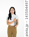 Smiling Asian Girl Holding Laptop on White Background Young Professional Business Woman Studio Portrait Smiling Asian Girl Holding Laptop on White Background Young Professional Business Woman Studio Portrait 143504497