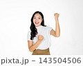 Excited Asian Girl Celebrating Victory with Raised Fist on White Background Excited Asian Girl Celebrating Victory with Raised Fist on White Background 143504506