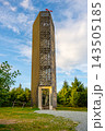 A tall tower stands atop Velka Destna, the highest peak of the Orlicke Mountains at 1,115 meters. Visitors can see the nature around the landmark as clouds pass by. 143505185