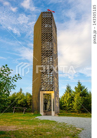 A tall tower stands atop Velka Destna, the highest peak of the Orlicke Mountains at 1,115 meters. Visitors can see the nature around the landmark as clouds pass by. A tall tower stands atop Velka Destna, the highest peak of the Orlicke Mountains at 1,115 meters. Visitors can see the nature around the landmark as clouds pass by. 143505185
