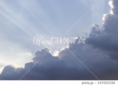 Dramatic Crepuscular Sun Rays Beaming Behind Dark Cumulus Clouds. Dramatic Crepuscular Sun Rays Beaming Behind Dark Cumulus Clouds. 143505298