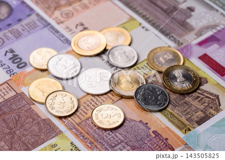 India paper money, rupee banknotes and coins as currency for exchange or travel. Indian money India paper money, rupee banknotes and coins as currency for exchange or travel. Indian money 143505825