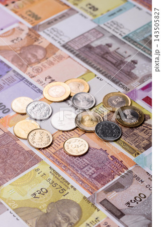 India paper money, rupee banknotes and coins as currency for exchange or travel. Indian money India paper money, rupee banknotes and coins as currency for exchange or travel. Indian money 143505827