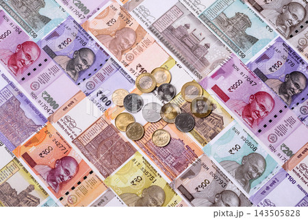 India paper money, rupee banknotes and coins as currency for exchange or travel. Indian money India paper money, rupee banknotes and coins as currency for exchange or travel. Indian money 143505828