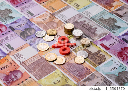 The percentage sign on cash as a concept for inflation or tax liabilities. The percentage sign The percentage sign on cash as a concept for inflation or tax liabilities. The percentage sign 143505870