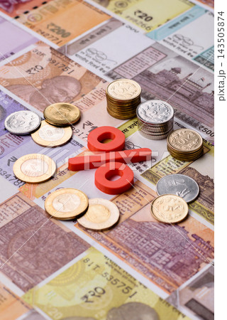 The percentage sign on cash as a concept for inflation or tax liabilities. The percentage sign The percentage sign on cash as a concept for inflation or tax liabilities. The percentage sign 143505874