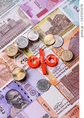 The percentage sign on cash as a concept for inflation or tax liabilities. The percentage sign 143505876