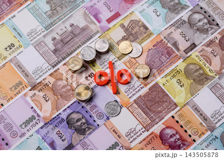 The percentage sign on cash as a concept for inflation or tax liabilities. The percentage sign The percentage sign on cash as a concept for inflation or tax liabilities. The percentage sign 143505878
