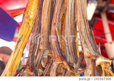 Norway fish market shows dried fish for sale in a busy outdoor setting 143507566