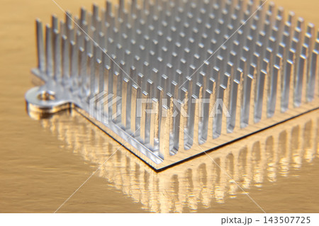 Aluminum heatsink with vertical fins resting on a reflective surface Aluminum heatsink with vertical fins resting on a reflective surface 143507725