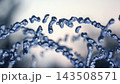 Microscopic view of blue strands reflecting light in a blurred background 143508571