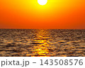 Sunset over the ocean with bright colors and reflections on the water surface 143508576