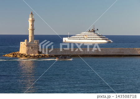 Luxury Yacht and Venetian Lighthouse in Chania, Crete, Greece Luxury Yacht and Venetian Lighthouse in Chania, Crete, Greece 143508718