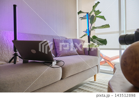 Home remote office space with laptop and colorful lighting Home remote office space with laptop and colorful lighting 143512898