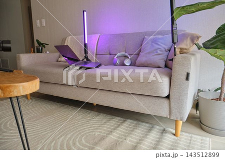 Remote workspace set up on sofa for productivity Remote workspace set up on sofa for productivity 143512899