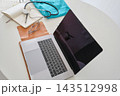Medical professional workstation with laptop, stethoscope, and notebook 143512998