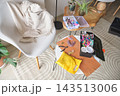 Crafting materials organized on a table for jewelry making 143513006