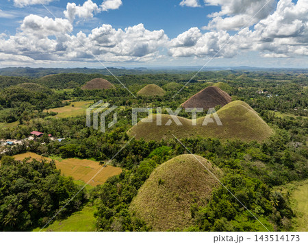 Lush green dome shaped hills forming the famous geological formation known as the Chocolate Hills in Bohol, Philippines Lush green dome shaped hills forming the famous geological formation known as the Chocolate Hills in Bohol, Philippines 143514173