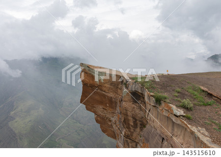 Rocky cliff edge Troll Tongue at scenic mountain gorge in Goor Rocky cliff edge Troll Tongue at scenic mountain gorge in Goor 143515610