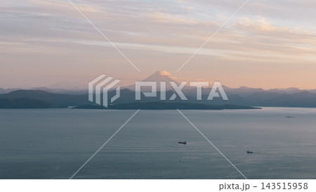 Sunset view of Avacha Bay and distant Vilyuchinsky volcano in Petropavlovsk-Kamchatsky Sunset view of Avacha Bay and distant Vilyuchinsky volcano in Petropavlovsk-Kamchatsky 143515958