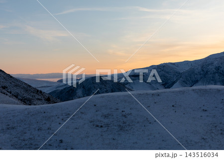 Sunset over Chunkurchak Valley with snow covered mountain hills in winter Sunset over Chunkurchak Valley with snow covered mountain hills in winter 143516034