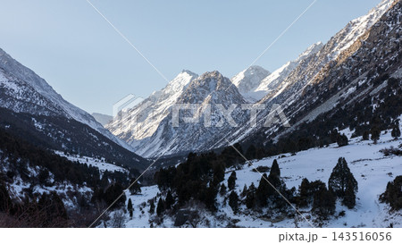 Panoramic view of snow covered peaks in the scenic Alamedin Gorge Panoramic view of snow covered peaks in the scenic Alamedin Gorge 143516056