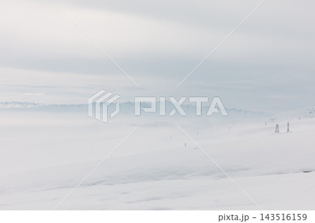 Panoramic winter landscape of snowy mountains at Ala-Bel Pass 143516159