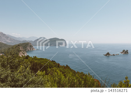 Scenic coastal view of Petrovac bay with rocky islands and mountains 143516271