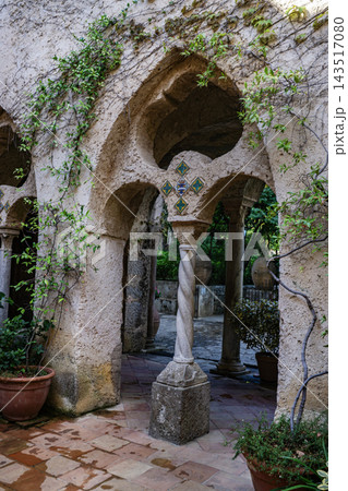 Villa Cimbrone, Ravello, Campania, Italy. Ancient tower and walls completely covered with greenery. Villa Cimbrone, Ravello, Campania, Italy. Ancient tower and walls completely covered with greenery. 143517080