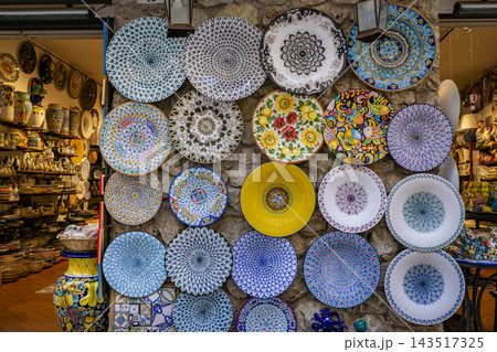 Amalfi, Italy - Traditional ceramic plates in souvenir shop Amalfi, Italy - Traditional ceramic plates in souvenir shop 143517325