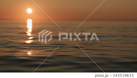 closeup small waves on a beach at sunset 143519633