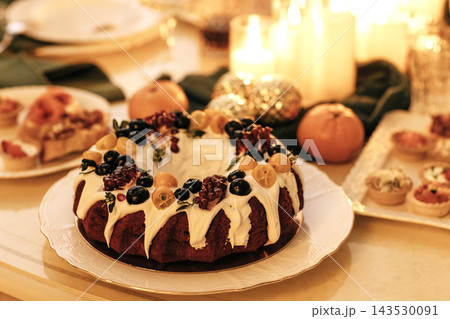 Delicious pie with fresh fruits and berries and snacks on the table. A party. 143530091