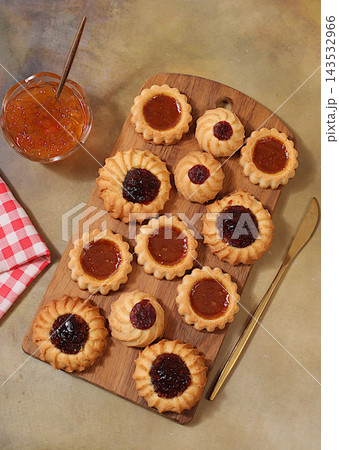 Freshly baked homemade shortbread cookies with jam and preserves on concrete background, modern bakery and grain based product concept. Healthy breakfast with ingredients, cafe and restaurant menu, Freshly baked homemade shortbread cookies with jam and preserves on concrete background, modern bakery and grain based product concept. Healthy breakfast with ingredients, cafe and restaurant menu, 143532966