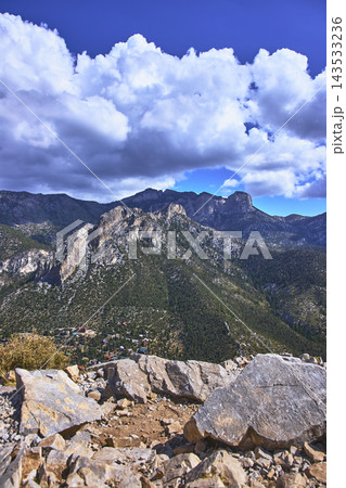 Cathedral Rock Summit View with Mt Charleston Peaks and Dramatic Clouds Nevada 143533236