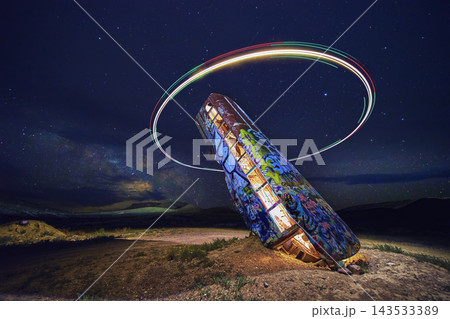 Abandoned Graffiti Vehicle at Night with Drone Light Ring and Starry Sky in Nevada Abandoned Graffiti Vehicle at Night with Drone Light Ring and Starry Sky in Nevada 143533389