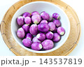 Fresh small purple eggplants arranged for cooking 143537819